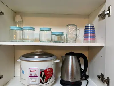 a tea pot and glasses on a shelf in a kitchen at Japan Vibe near Ayala Feliz Mall 2BR 55sqm with Veranda Netflix Pool in Manila