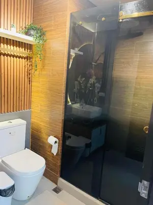 a bathroom with a toilet and a sink at 19s CAI in Manila