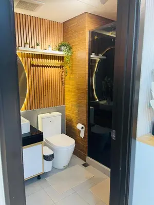 a bathroom with a toilet and a sink at 19s CAI in Manila