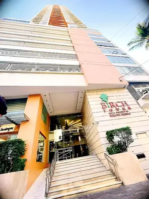 a tall building with stairs in front of it at Birch Tower Ocean View Unit in Manila