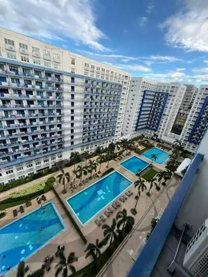 an aerial view of a large apartment building with two pools at Sea Residences Vertex in Manila