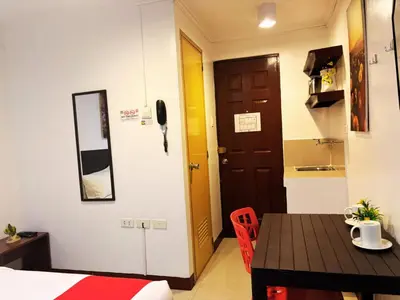 a small room with a table and a door at City Stay Inns Slex Makati in Manila