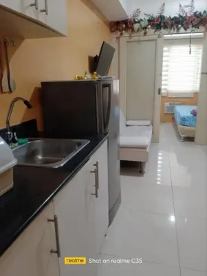 a kitchen with a sink and a counter top at Kaoru Properties in Manila