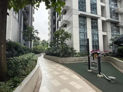 a walkway in front of a tall building at Panoramic Views 2BR Family Stay in Mckinley BGC in Manila