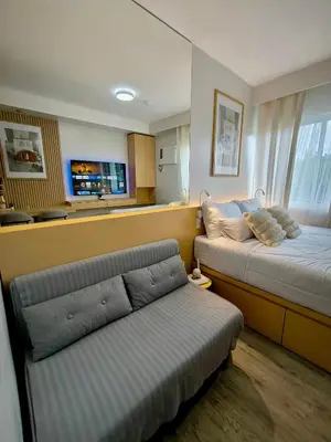 a living room with two beds and a couch at Prime Zen in Silang