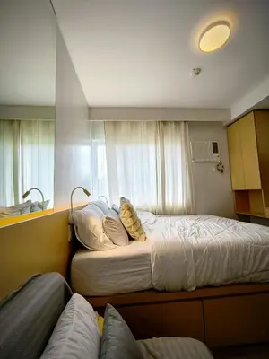 a hotel room with two beds and a couch at Prime Zen in Silang