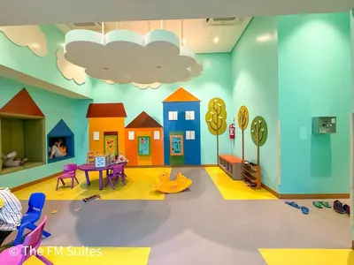 a room with a play room with a toy house at Cozy and Spacious Fast WiFi FREE Access Pool and Gym in Manila