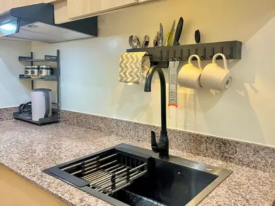 a kitchen with a sink and a counter top at 1 Bedroom Condo Unit Near SM City Sucat and NAIA Terminal in Manila