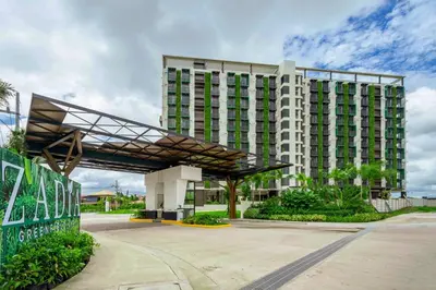 a large building with a canopy in front of it at Semi Furnished Condo at Sta Rosa Zadia Tower 2 in Sampong