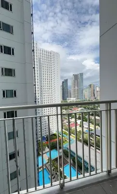 a balcony with a view of a building at Jazz Luxe Getaway in Manila