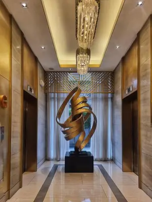 a sculpture in the lobby of a hotel at Luxe Studio at Fame Residences Malls, CBDs and More in Manila