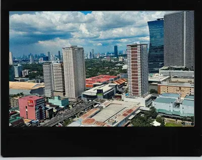 a view of a city with tall buildings at Luxe Studio at Fame Residences Malls, CBDs and More in Manila
