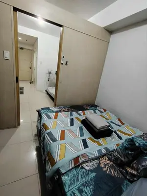 a bedroom with a bed in a room at Sea Residence Condotel Pasay in Manila