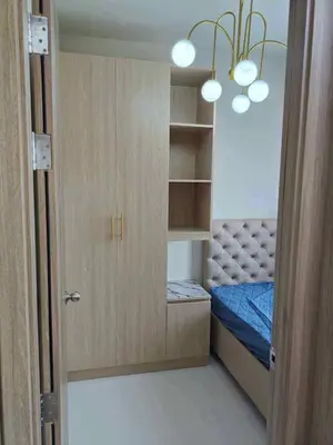 a small room with a bed and a closet at Cozy Minimalist Staycation in Manila