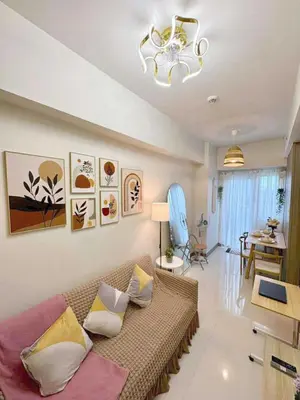 a living room with a couch and a table at Horizon Haven in Manila