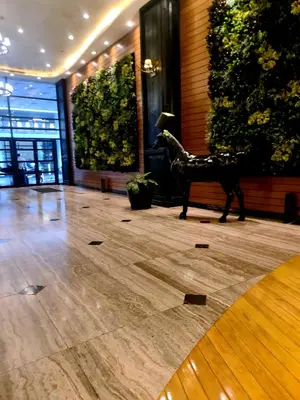 a statue of a horse on the floor of a lobby at Condominium unit Knightsbridge Residences, Makati in Manila