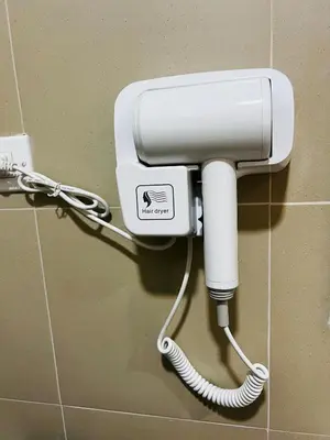 a white phone on a wall in a bathroom at MOA GRAND STAY Suite #01, Newly Turn-over Only! in Manila