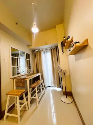 a room with a desk and chairs and a window at MOA GRAND STAY Suite #01, Newly Turn-over Only! in Manila