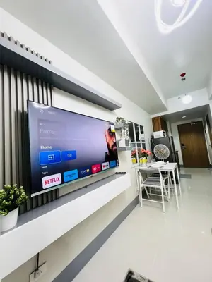 a large flat screen tv on a wall in a room at MOA GRAND STAY Suite 02 Newly Turn-over Only in Manila