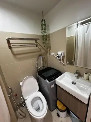 a bathroom with a toilet and a sink at MOA GRAND STAY Suite 04 Newly Turn-over Only! in Manila