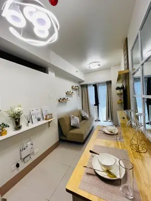 a living room with a table and a couch at MOA GRAND STAY Suite 04 Newly Turn-over Only! in Manila