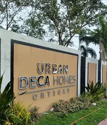 a sign at the entrance to a hotel at Family Game Night 2BR PS4 Netflix Disney in Manila