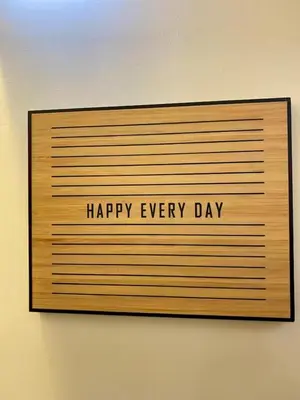 a sign that says happy every day on a wall at Family Game Night 2BR PS4 Netflix Disney in Manila