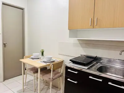 a kitchen with a small table with two cups on it at Hirayuna Space in Santa Rosa