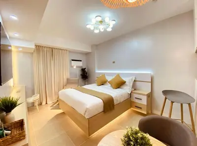 a bedroom with a large bed in a room at A Secret Space in Sucat Parañaque in Manila