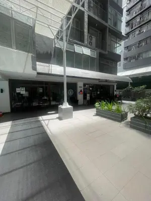 a building with a pole in the middle of a courtyard at Antel Spa Residences 15A in Manila