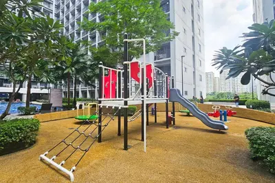 a playground in a park with a slide at Condo in SM Mall of Asia MOA near NAIA Airport in Manila