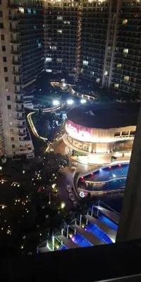 a view of a city at night with buildings at Casa Neutra - A Cozy Retreat in Manila in Manila