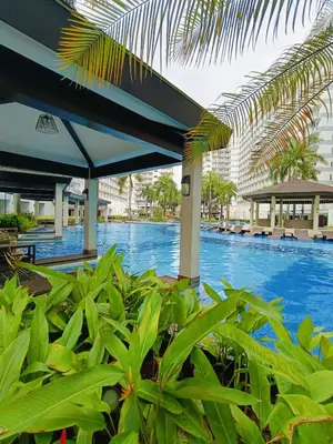 a view of a swimming pool at a resort at Shell Residences Mall of Asia by Jhem in Manila