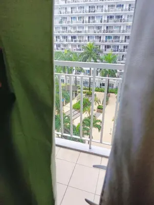 a view of a building from a window at Shell Residences Mall of Asia by Jhem in Manila