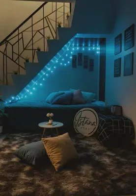 a blue room with a bed with a staircase at Islana Stay Rm B for 1pax only in General Trias