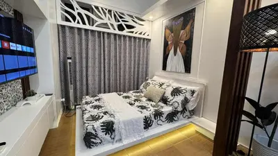 a small room with a bed and a window at 1BR Pioneer Woodland Condominium connected to BONI Metro Rail Station,Boni Mandaluyong Metro Manila in Manila