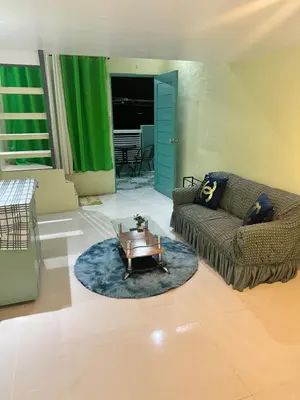 a living room with a couch and a coffee table at SJ Vistacation