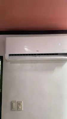 a white refrigerator freezer with its door open at 1 Bedroom Townhouse with Airconditon ,Water heater and free wifi,fully furnished in San Roque