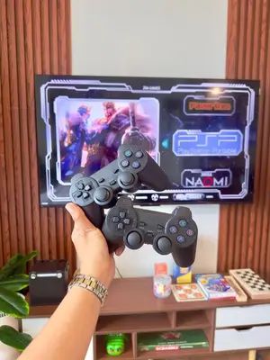 a person holding a video game controller in front of a tv at Cityscape Staycation by H&B in Manila