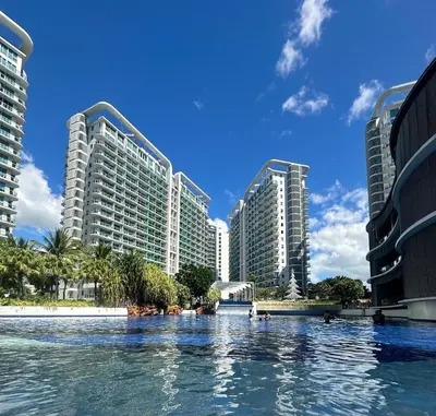 a swimming pool in front of some tall buildings at Cityscape Staycation by H&B in Manila