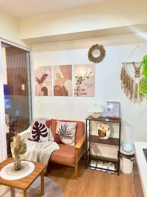 a living room with a couch and a table at Cityscape Staycation by H&B in Manila
