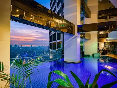 a view of a city from a building with a pool at Hidden Village at Gramercy Residences - APARTMENT with Infinity Pool Sauna Gym in Manila