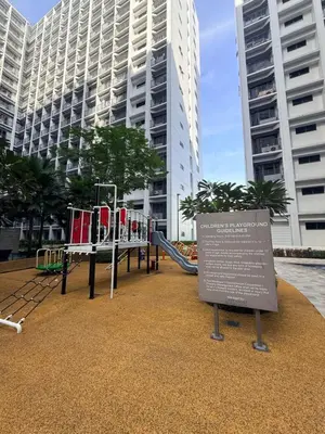 a playground in front of some tall buildings at Affordable Stay at Shore Residence near MOA by VCA Staycation in Manila