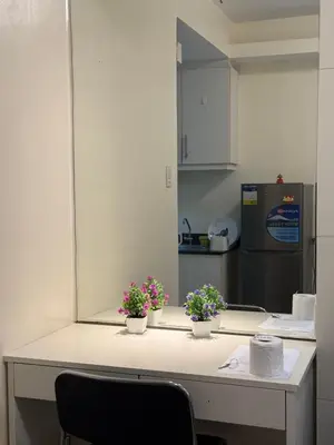 a kitchen with two potted plants on a counter at Sea Residences Staycation SMDC Property in Manila