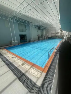 a large swimming pool in a large building at Antel Spa Residences 1014 in Manila