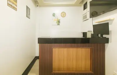 a reception desk in a room with a counter at UrbanView at Mherylle's Apartment near UST Manila in Manila