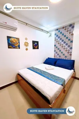 a bedroom with a bed in a room at Suite Haven Staycation in Sampong