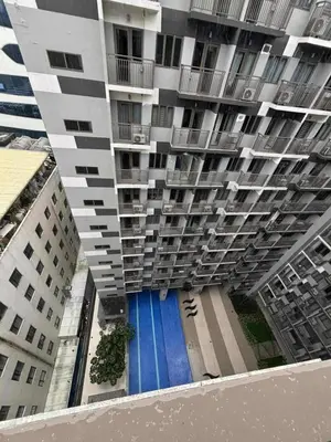 an overhead view of a building with a blue pool at Mystix's Pad in Manila