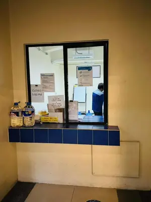 a blue counter with a window in a room at Mid-rise staycation in parañaque in Manila