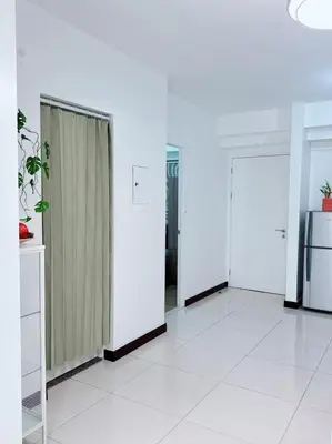 a room with white walls and a row of doors at Place to stay in pasay near Airport in Manila